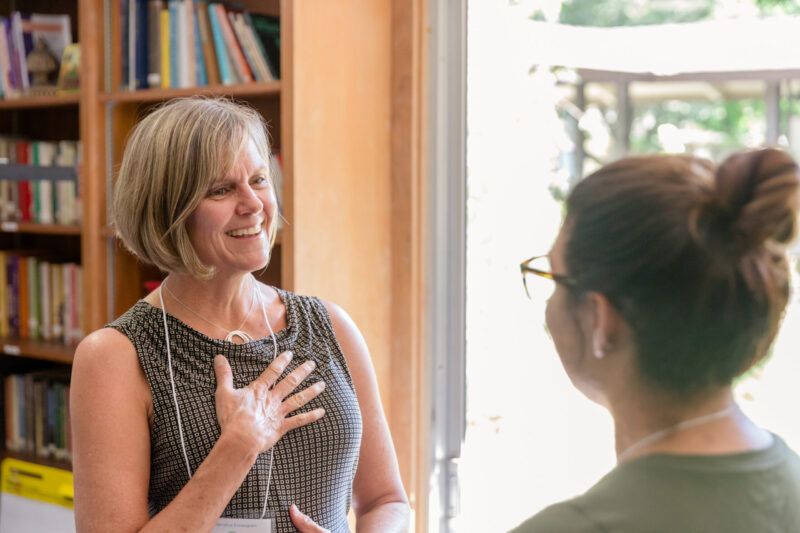 two women speaking in dyad