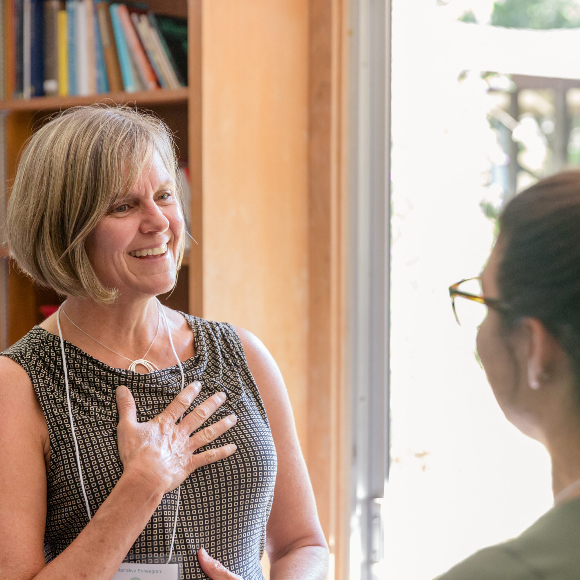 two women speaking in dyad