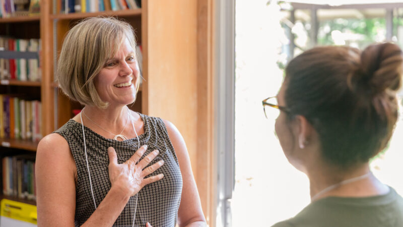 two women speaking in dyad