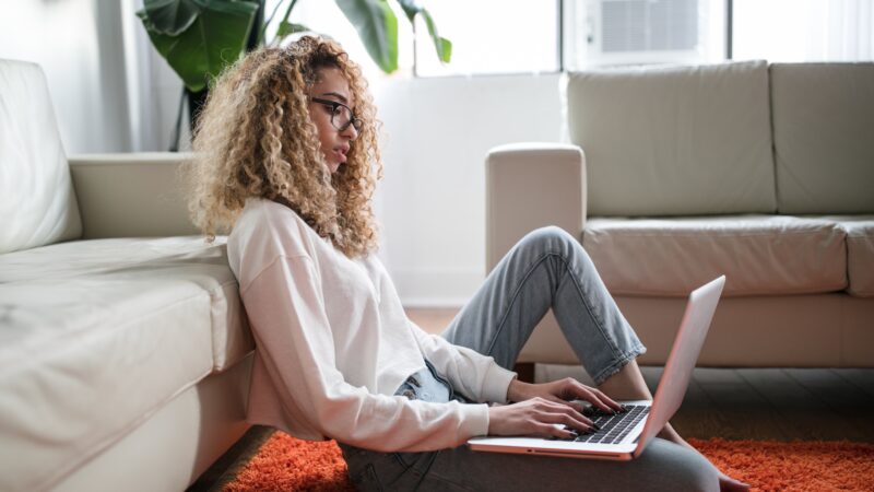A woman at her computer participating in on online Enneagram class
