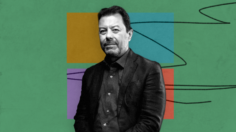 black and white photo of man on green background with 4 colored blocks and pencil scribble
